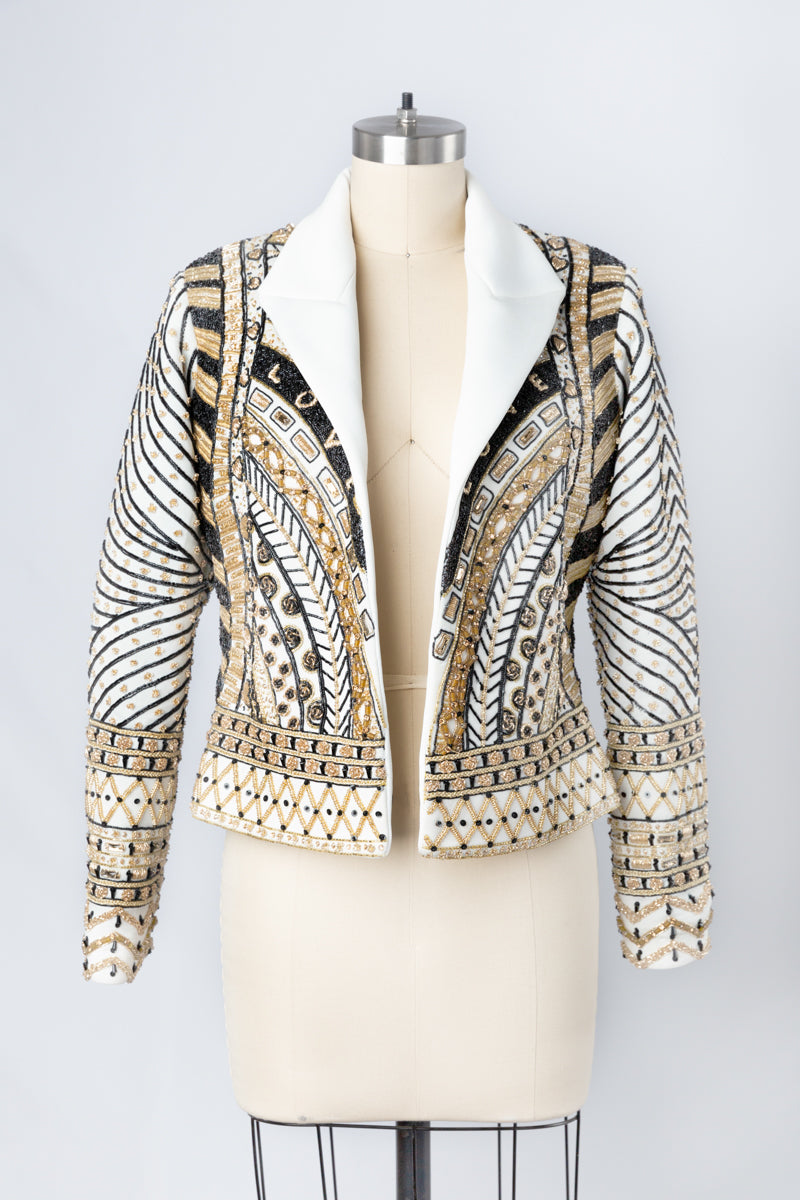 Indulge in the allure of this black and gold couture jacket from Andre Yabin, where artistry, elegance, and customization converge to create an exceptional wearable masterpiece. Don't miss the opportunity to be a part of this unparalleled experience. Schedule your appointment now to discover the world of Andre Yabin's couture excellence firsthand.