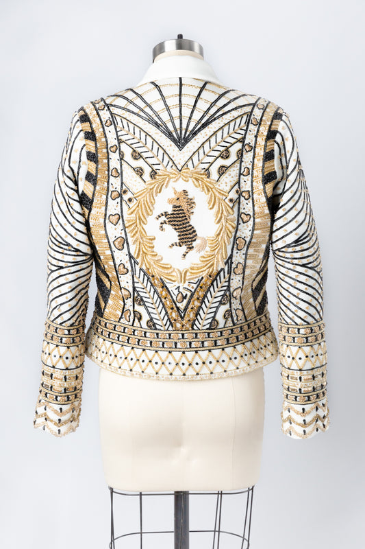 Indulge in the allure of this black and gold couture jacket from Andre Yabin, where artistry, elegance, and customization converge to create an exceptional wearable masterpiece. Don't miss the opportunity to be a part of this unparalleled experience. Schedule your appointment now to discover the world of Andre Yabin's couture excellence firsthand.