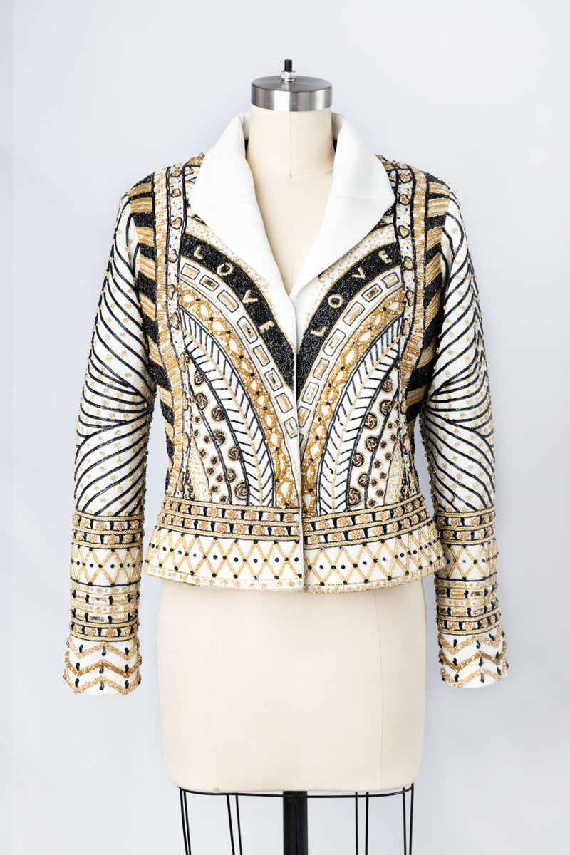 Indulge in the allure of this black and gold couture jacket from Andre Yabin, where artistry, elegance, and customization converge to create an exceptional wearable masterpiece. Don't miss the opportunity to be a part of this unparalleled experience. Schedule your appointment now to discover the world of Andre Yabin's couture excellence firsthand.